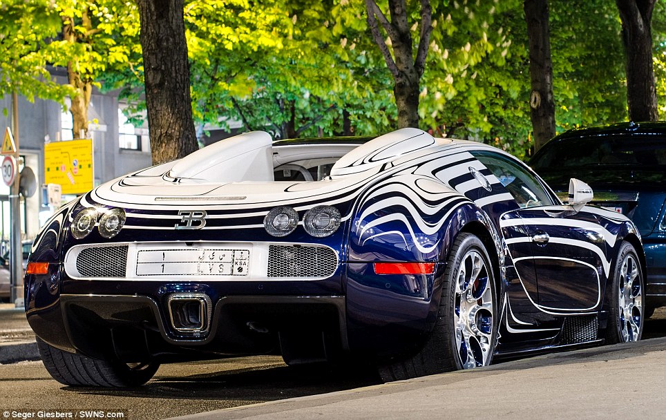 That's one cracking motor! Brave owner parks his unique Bugatti Veyron supercar made of porcelain in Paris street