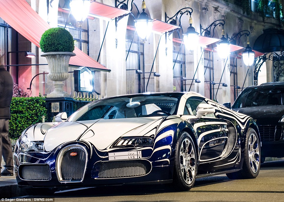 That's one cracking motor! Brave owner parks his unique Bugatti Veyron supercar made of porcelain in Paris street