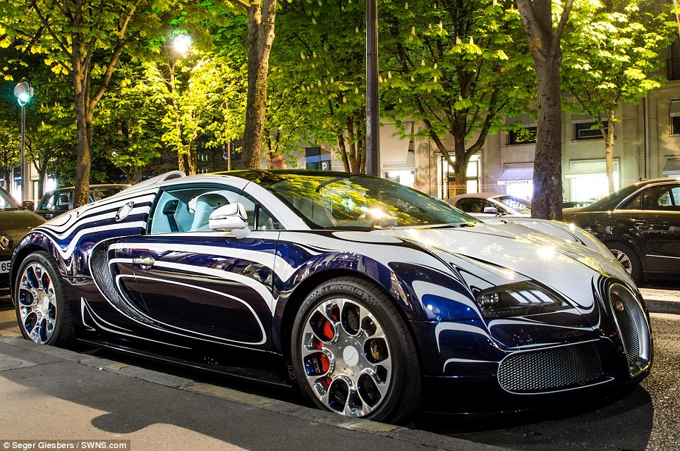 That's one cracking motor! Brave owner parks his unique Bugatti Veyron supercar made of porcelain in Paris street