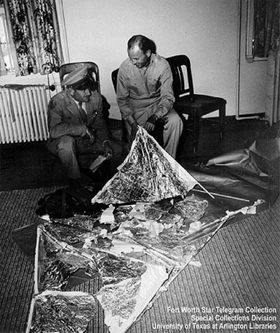  Roger Ramey, left, holding letter, while DuBose looks over wind-forecasting device at Fort Worth Army Airfield brought from Roswell