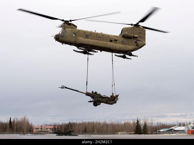 A U.S. Army CH-47 Chinook helicopter operated by the 1-52nd General Support Aviation Battalion, lifts a M777 towed 155 mm howitzer while conducting sling load training in support of exercise Yudh Abhyas