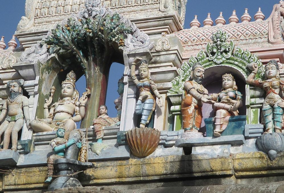 Stucco image of the legend of Mango tree and the Mango tree behind the sanctum