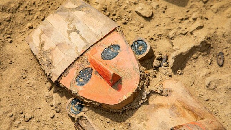 Wooden sculpture depicting a litter bearer of a ruler unearthed at Chan Chan, Peru.