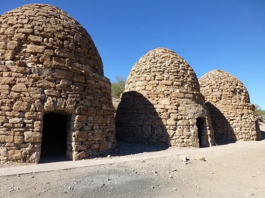 There is a three-foot by six-foot door at the front and a three-foot by five-foot opening at the upper rear of each structure.These ovens are approximately thirty feet tall and have an inner diameter of twenty five feet.