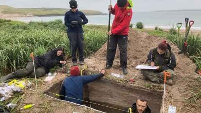 An excavation site at Sandy Bay on Enderby with the team hard at work. Credit: University of Auckland