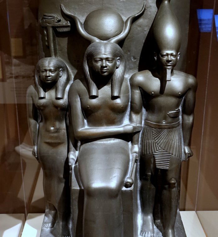 Copy of a statue of Hathor (center) with a goddess personifying the Fifteenth Nome of Upper Egypt (left) and the Fourth Dynasty king Menkaure (right); 26th century BC