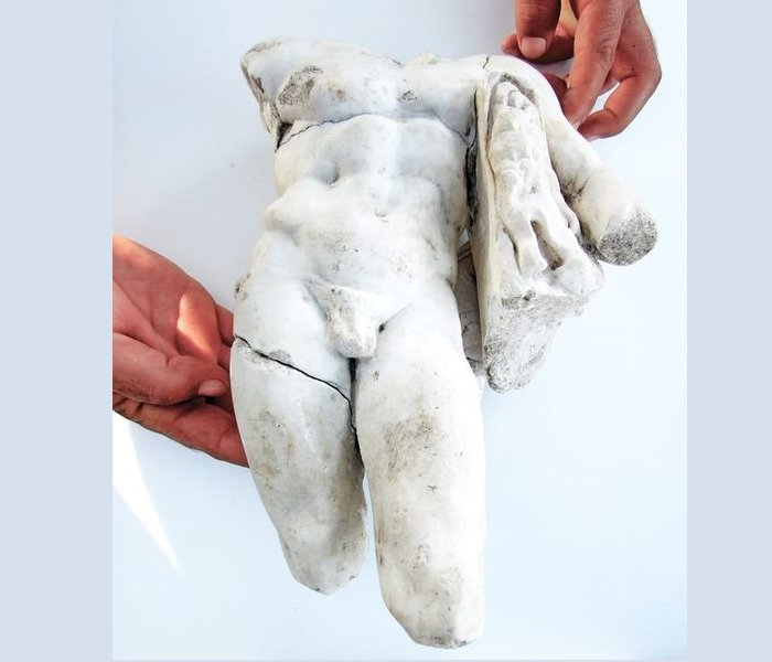 Fragment Of A Fine Marble, About Half A Meter High Statuette Of Heracles . Image credit: PH๏τo: Courtesy of the Israel Antiquities Authority