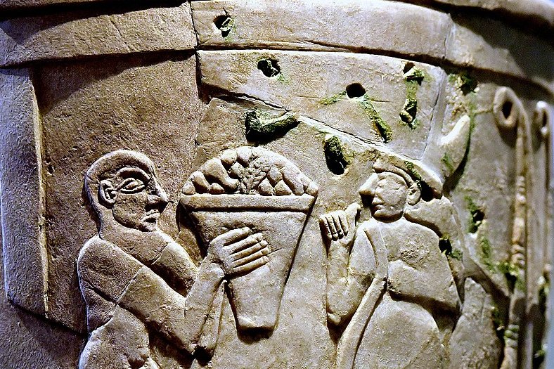 Inanna receiving offerings on the Uruk Vase, circa 3200-3000 BC.