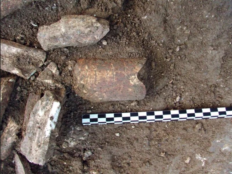 Bone fragment with what are thought to be 120,000-year-old markings etched onto it from Ramle, Israel. Image credit: Dr Yossi Zaidner/HUJIA 