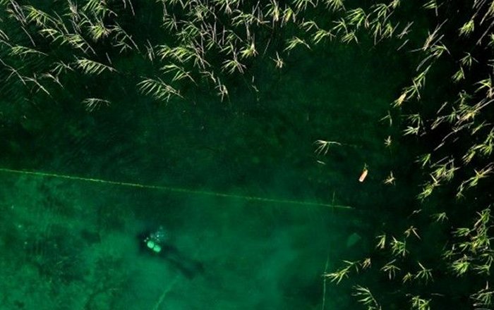 A diver scouring an archaeological site at the bottom of Lake Ohrid in Albania, the site of Europe's oldest stilt village AFP / Adnan Beci