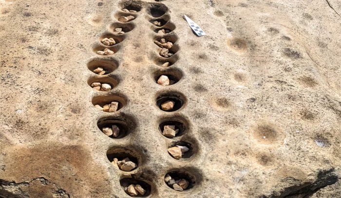 'Arcade' Of Ancient Mancala Game Boards Carved Into Rock Found In Kenya