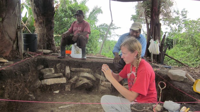 Uxbenká Archaeological Project member and lead author AE Thompson pH๏τographing an excavation of a Classic Maya house mound. Credit: KM Prufer