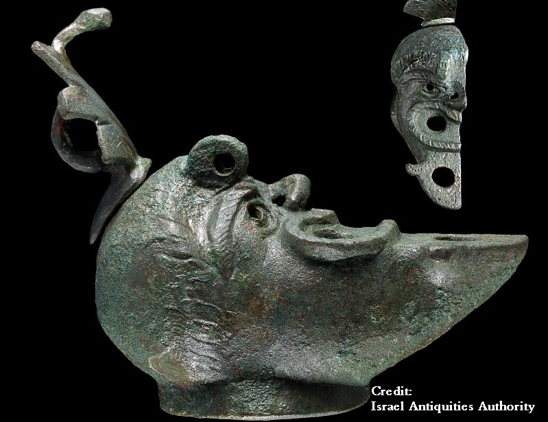 Rare bronze oil lamp with a face cut in half unearthed in Israel. Credit: Koby Harati, City of David; Eliyahu Yanai, City of David; Dafna Gazit, Israel Antiquities Authority