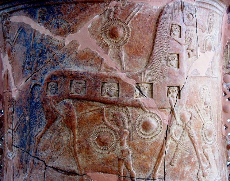  The Mykonos vase, with one of the earliest known renditions of the Trojan Horse. (Note the depiction of the faces of hidden warriors shown on the horse's side.) Image credit: Travelling Runes 