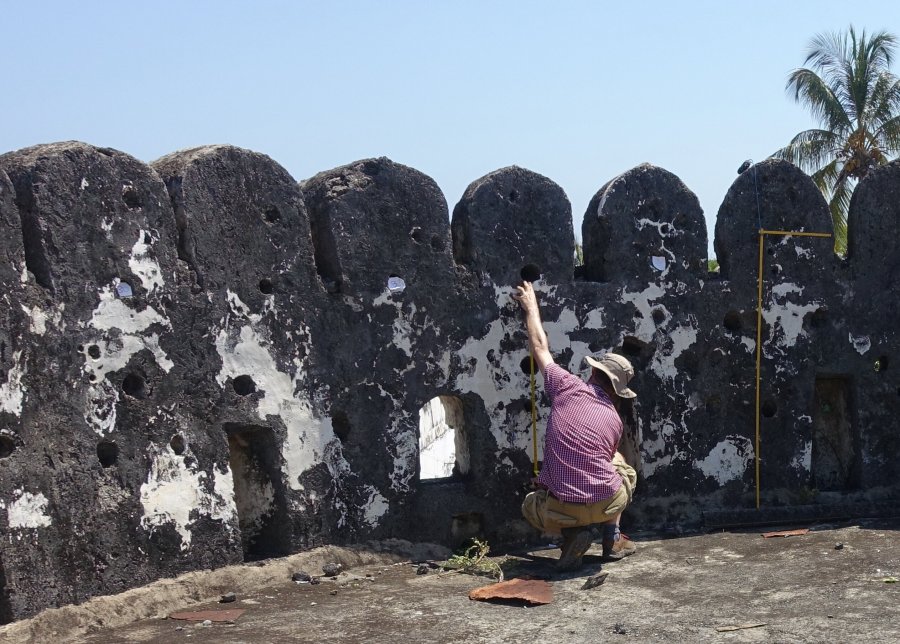 Dr Alessandro Ghidoni records a ship graffito in the southwestern tower of Zanzibar Fort. Credit: John P Cooper